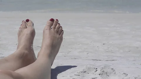View of Feet Relaxing on the Beach (2 of 4) Stock Footage 48690746