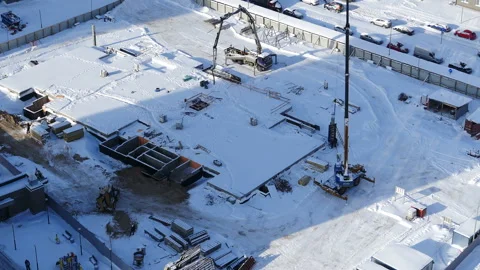 View of the fenced construction site of a building in the winter Stock Footage 149791030