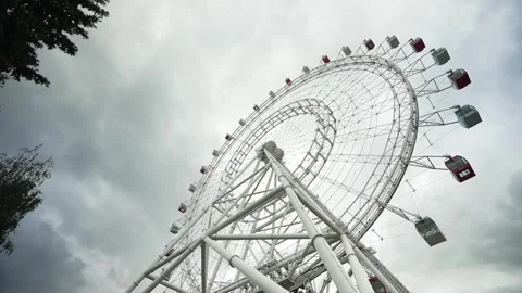 View of the Ferris wheel from below. Ferris wheel. Filmed in motion. Stock Footage 336795348