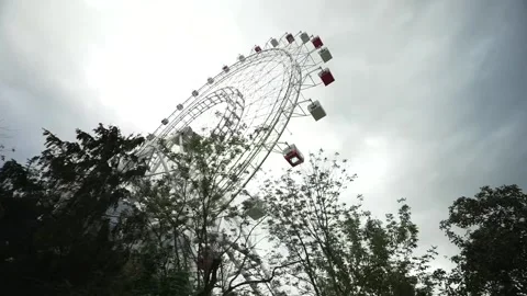 View of the Ferris wheel from below. Ferris wheel. Filmed in motion. Stock Footage 336795360