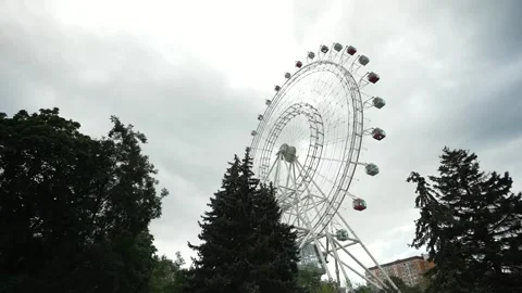 View of the Ferris wheel from below. Ferris wheel. Filmed in motion. Stock Footage 336795384
