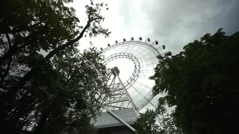 View of the Ferris wheel from below. Ferris wheel. Filmed in motion. Stock Footage 336795388