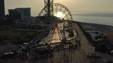 View of the ferris wheel from a drone, beautiful view at sunset Stock Footage 152037408