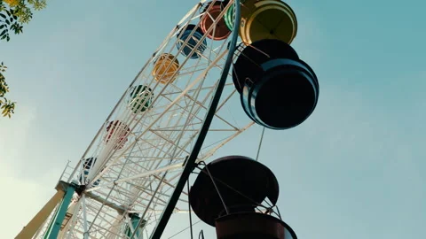 View of a ferris wheel over blue sky Видео 140640239