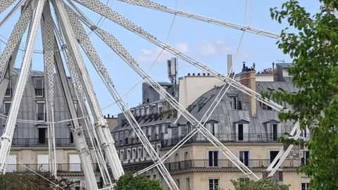 View Of The Ferris Wheel Structure And Historic Buildings At Fete Des Tuileries Stock Footage 342780464