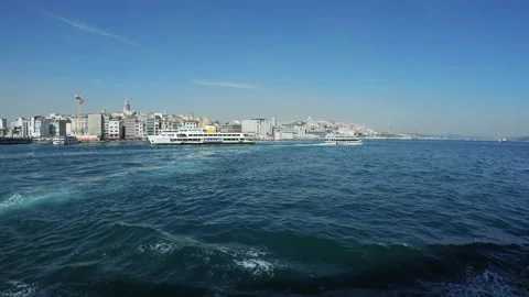 View from the ferry on Galata Tower and Karakoy quarter in Istanbul - Wide, 4K Stock Footage 155533687