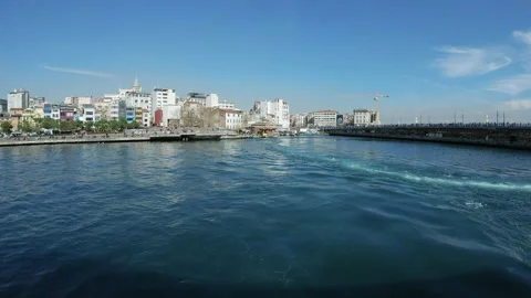 View from the ferry moving under Galata Bridge in Istanbul - Wide, 4K Stock Footage 155533975