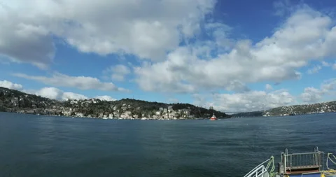 View from the ferry on small red boat and Bosphorus Stock Footage 150045529