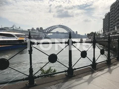 View of ferry, Sydney harbour bridge and ocean liner Stock Photos
