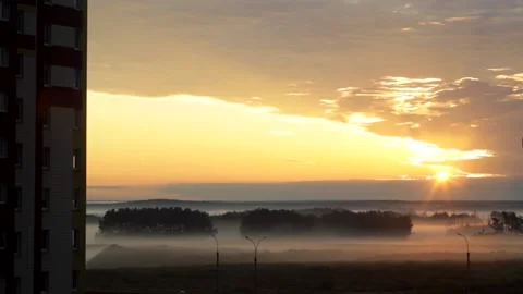 A view of the field, clouds move across the sky, the sun peeks out Stock Footage 146775694