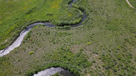 View of a field with curve river Stock Footage 248116079