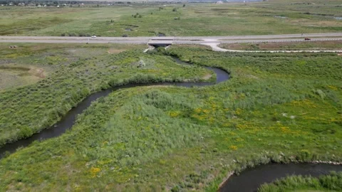 View of a field with curve river Stock Footage 248116085