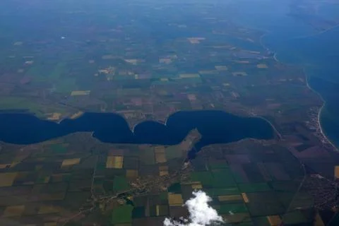 View of the fields from the window of the plane. View of the earth's surface Stock Photos