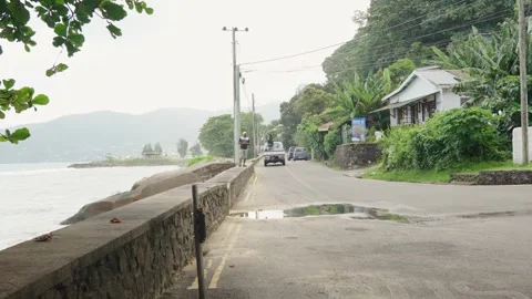 View from final bus stop of Danzil Bus Station with coastal road, ocean Stock Footage 331505441
