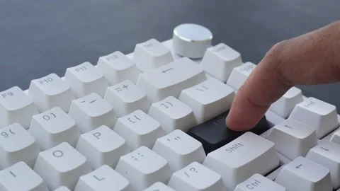 View of a finger pressing the Enter key on a mechanical keyboard. Stock Footage 338441113