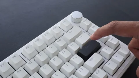 View of a finger pressing the Enter key on a mechanical keyboard. Stock Footage 338441134