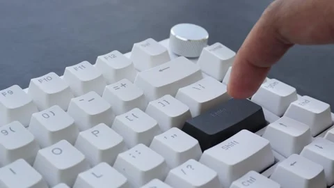 View of a finger pressing the Enter key on a mechanical keyboard. Stock Footage 338441146