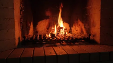 View of fire in home fireplace in complete darkness Stock Footage 342405595