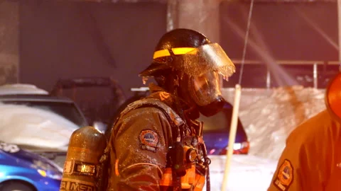 View of a firefighter with full equipment after extinguishing the fire, Stock Footage 205581857