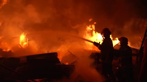 View of firefighters battling a massive blaze, Bangladesh. Video stock 335561846