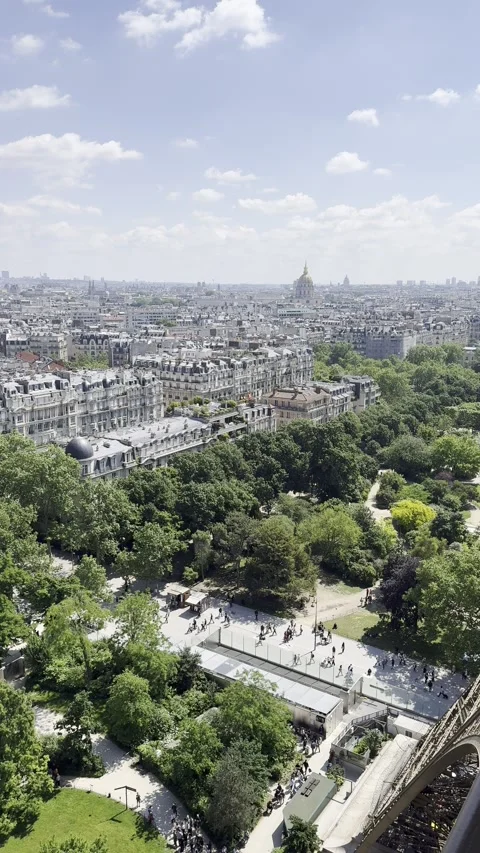 View from first floor of Eiffel Tower overlooking Paris, France in spring Stock Footage 337196744