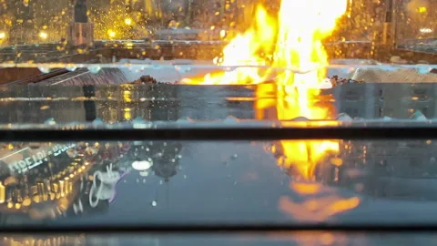 View of the flame of fire through the protective glass that is lit on the street Stock Footage 166274847
