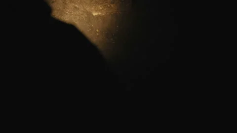 View of flashlight's shadow in darkness of the ancient stone cave Video stock 87834291
