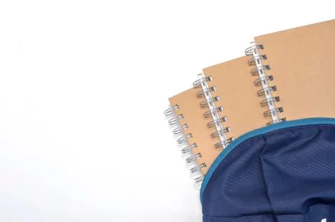 View of flat lay with school backpack and stationery with space for text on w Stock Photos