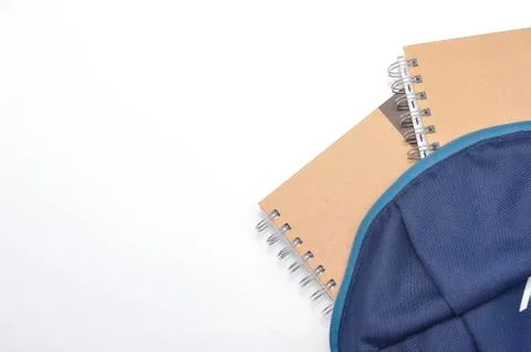 View of flat lay with school backpack and stationery with space for text on w Stock Photos
