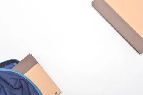 View of flat lay with school backpack and stationery with space for text on w Stock Photos