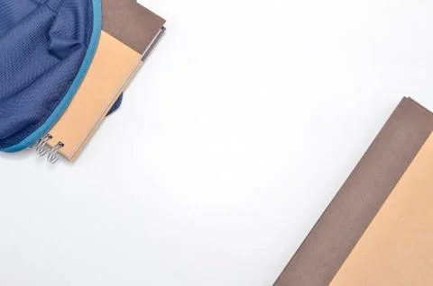 View of flat lay with school backpack and stationery with space for text on w Stock Photos