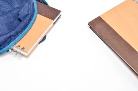 View of flat lay with school backpack and stationery with space for text on w Stock Photos