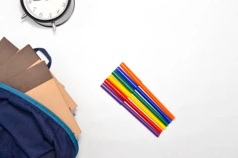 View of flat lay with school backpack and stationery with space for text on w Stock Photos