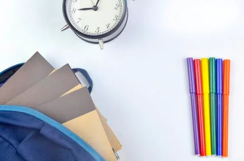 View of flat lay with school backpack and stationery with space for text on w Stock Photos