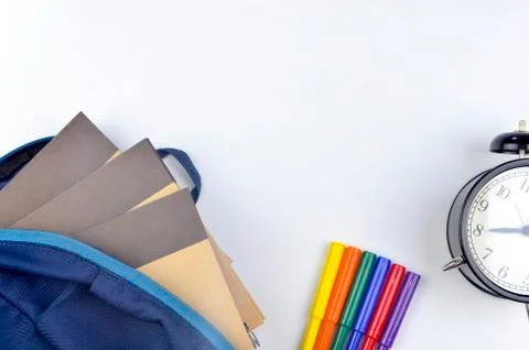 View of flat lay with school backpack and stationery with space for text on w Stock Photos