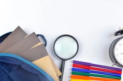 View of flat lay with school backpack and stationery with space for text on w Stock Photos