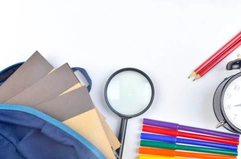 View of flat lay with school backpack and stationery with space for text on w Stock Photos