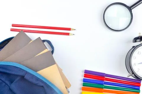 View of flat lay with school backpack and stationery with space for text on w Stock Photos