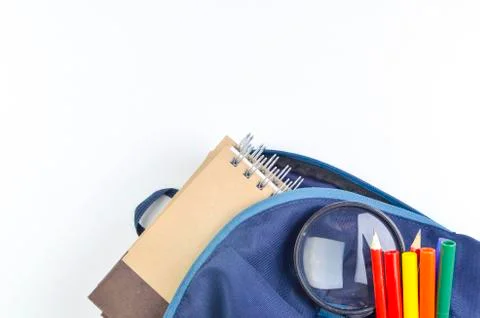 View of flat lay with school backpack and stationery with space for text on w Stock Photos