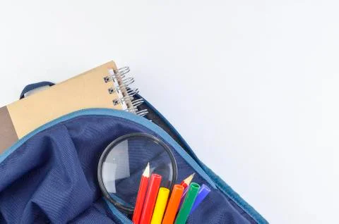 View of flat lay with school backpack and stationery with space for text on w Stock Photos
