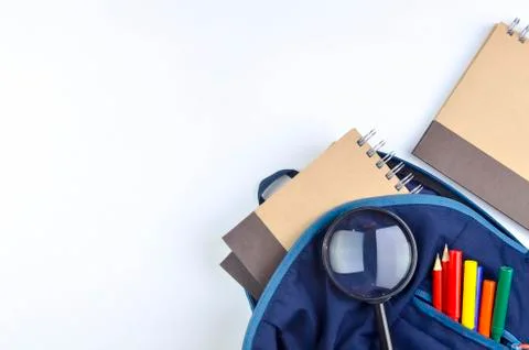 View of flat lay with school backpack and stationery with space for text on w Stock Photos