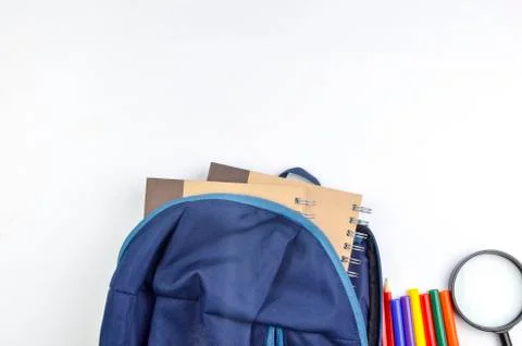 View of flat lay with school backpack and stationery with space for text on w Stock Photos