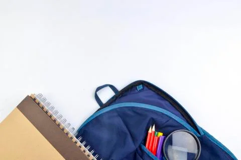 View of flat lay with school backpack and stationery with space for text on w Stock Photos