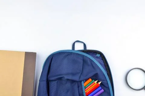 View of flat lay with school backpack and stationery with space for text on w Stock Photos