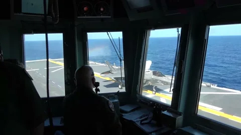 View from flight deck of U.S. Marines F-35B conducting vertical landing  Stock Footage 162320646