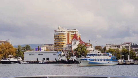 View from the floating boat: Two sea tugboats moored in the city port. Stock Footage 107031499