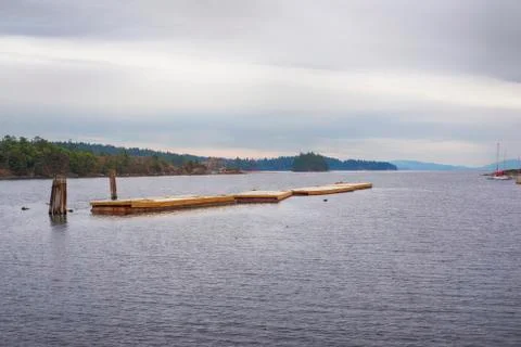 View of floating deck in Oyster Bay, town of Ladysmith, BC, with the Canadian Stock Photos