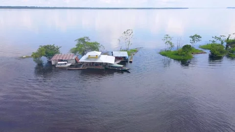 View of floating homes on the Amazon River Stock Footage 330925812