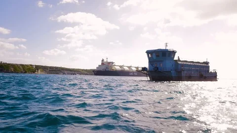View of a floating ship on the water from a boat, clean clear water, sea Video stock 101812014