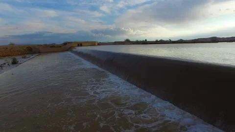 View of a flooded river on a semi cloudy day capturing, stock footage. Stock Footage 304784375